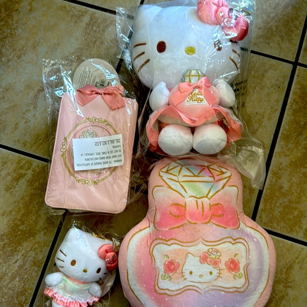 Very beautiful bundle of (4)  hello Kitty diamond collection